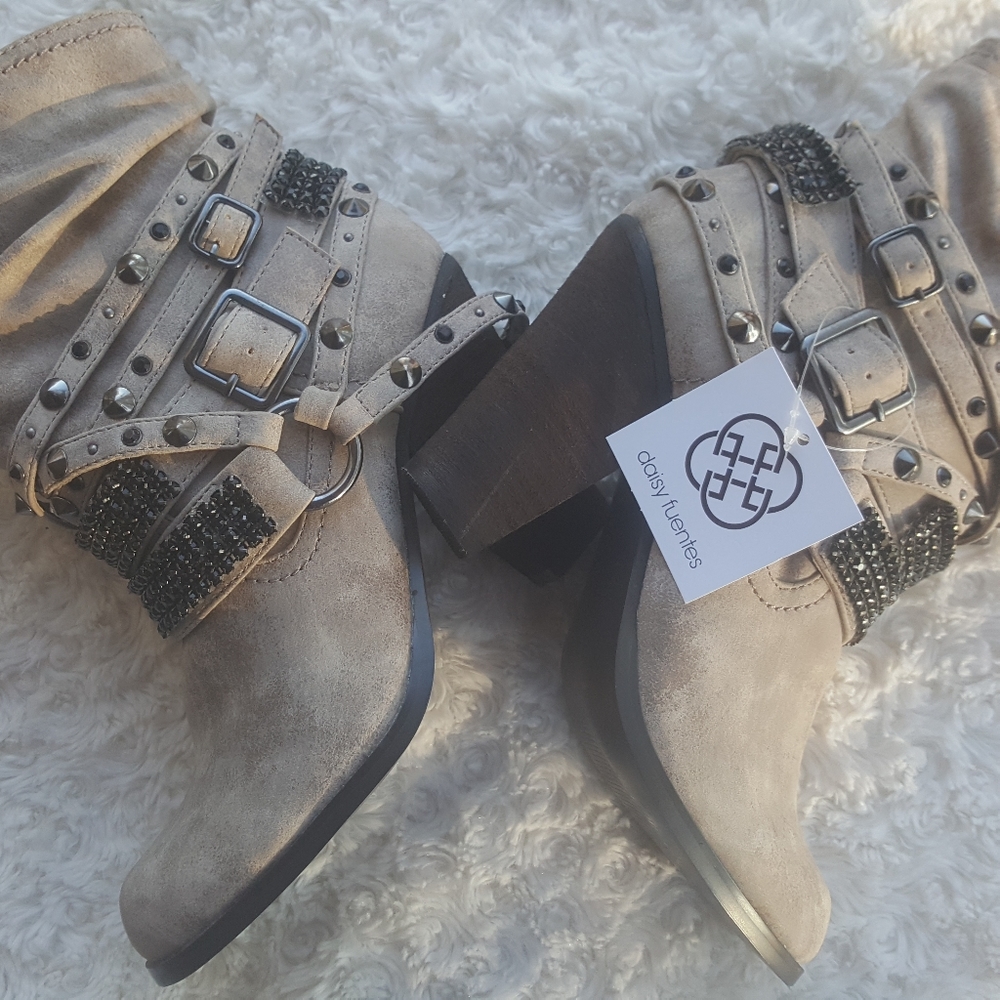 Daisy Fuentes boots with a 2 inch heel.